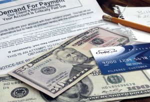 Photo of contract, credit card and US cash.