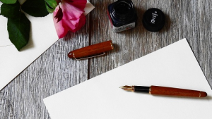 Pen and paper for a written invitation.